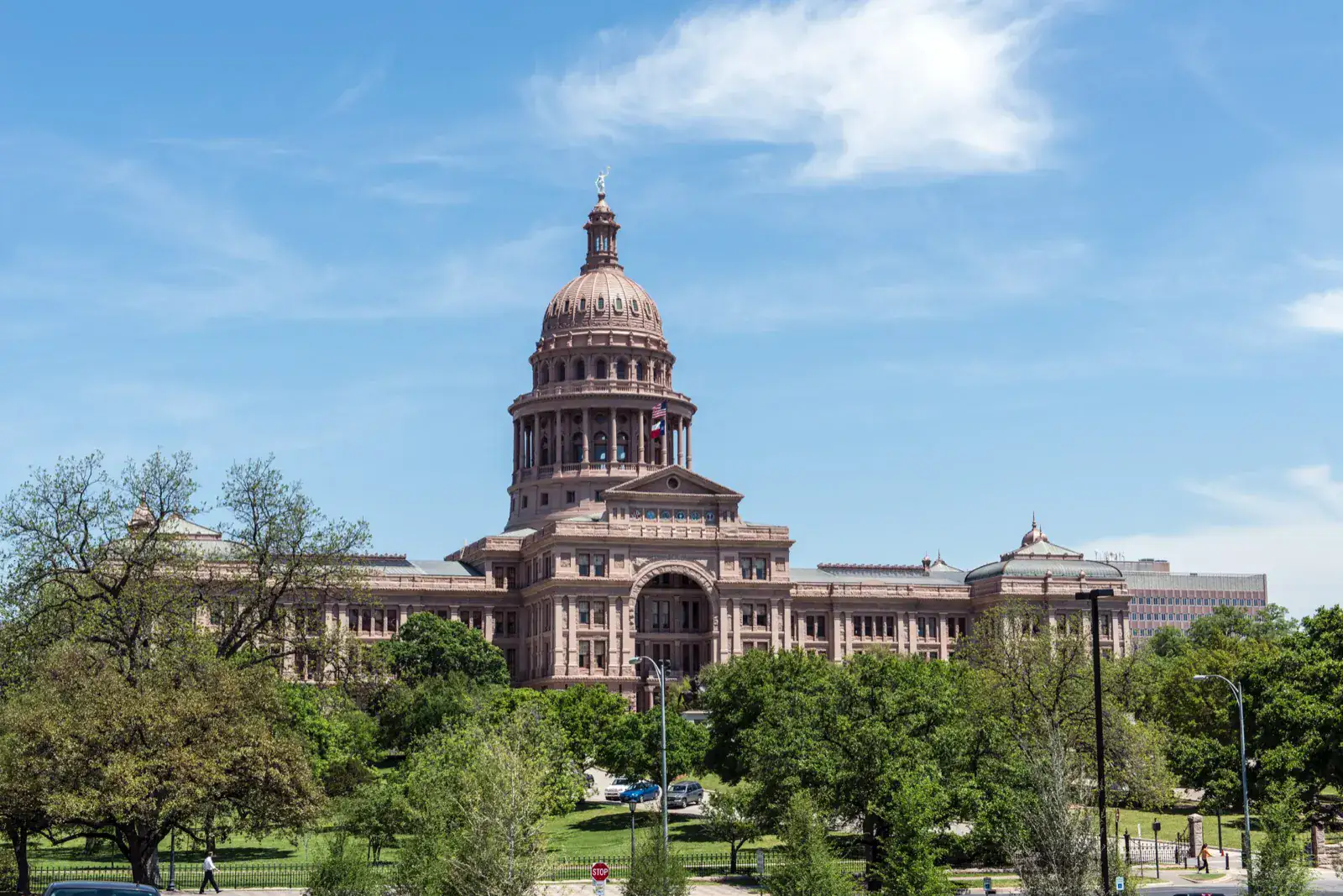 Unclaimed mineral royalties: the Texas State Capitol in Austin seen across trees and lawns