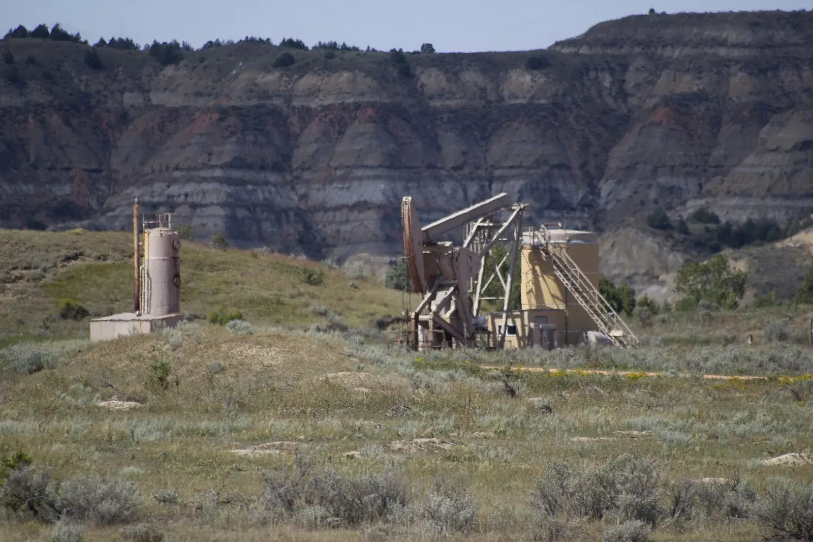 An oil well in the badlands of the Dakota Prairie Grasslands, North Dakota, the kind of production a royalty company earns from