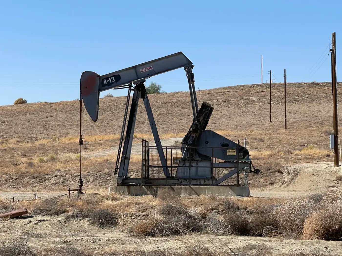 A pumpjack on a dry hillside in the Coalinga oil field, California
