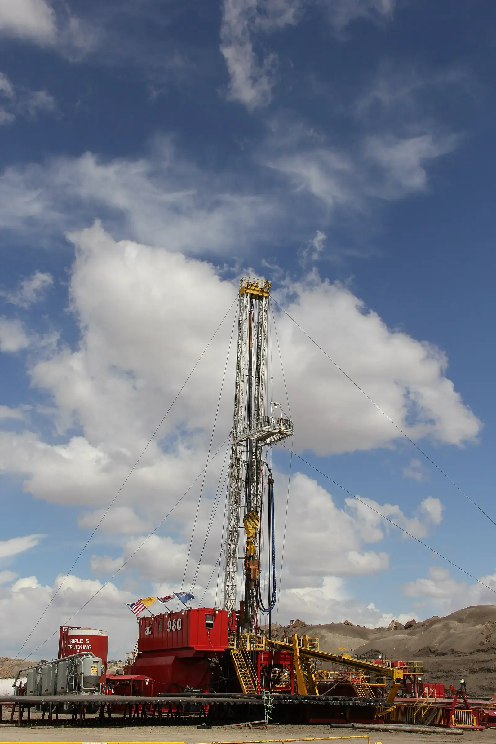 Sell mineral rights in New Mexico: a drilling rig under a cloudy sky southwest of Farmington, New Mexico