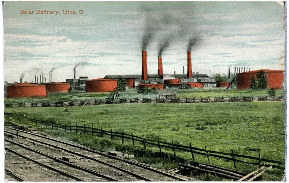 Smokestacks and storage tanks of the Solar Refinery at Lima, Ohio, on a 1913 color print